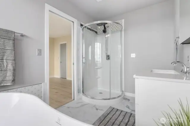 The fully remodeled primary bathroom is fresh, bright, and inviting.  Tastefully designed to start and end your day in comfort.