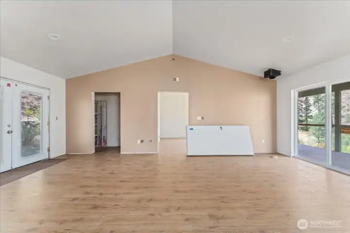 From living room, small bathroom to the left and primary bedroom straight ahead.