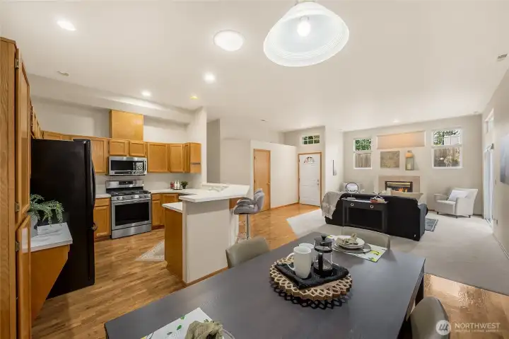 Seamless open living - kitchen, dining, and living room flow together in one bright, inviting space.