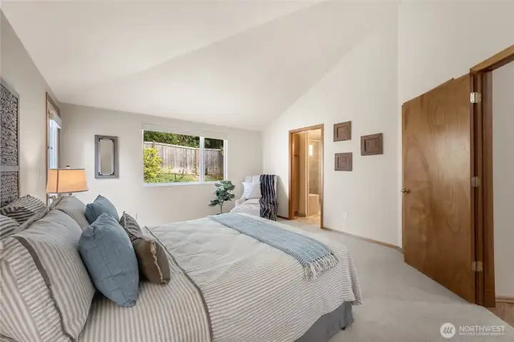The spacious primary suite also includes its own private bath and large walk-in closet.
