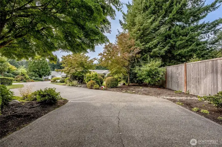 Ideally located in the community, this home enjoys a private end-lot setting down a long driveway.