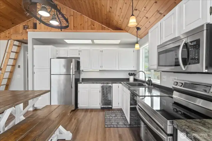 Beautiful kitchen and custom table will stay with the home! See other photos, just updated the lighting fixtures!