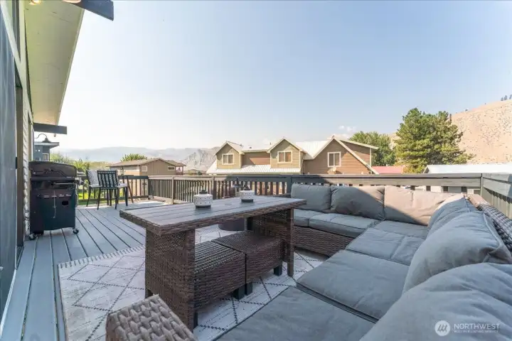 Huge entertainment deck looking west over river with a view of the mountains!