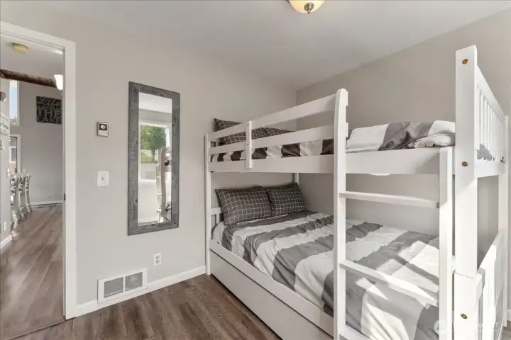 Main floor 2nd bedroom with full size double. beds.