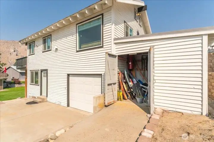 Plenty of parking plus attached garage and a storage shed!