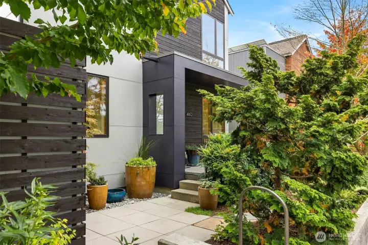 From the updated flagstone pathway to the clever rain catchment system and carefully chosen plantings, you'll find thoughtful additions to this move-in-ready Winslow townhome.