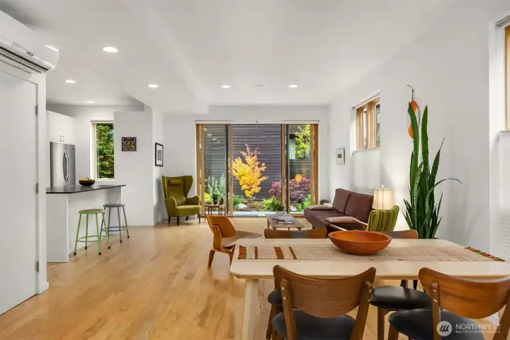 Sit down in the open entry to take your boots off with a view of the Coral Bark Japanese Maple.