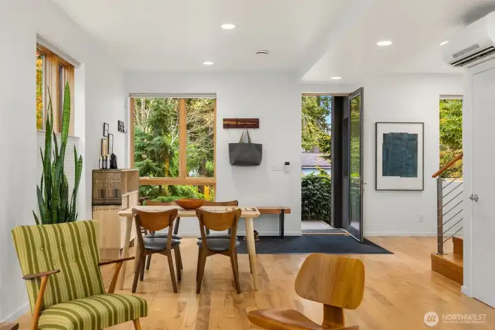 Elegant design draws your eyes to cherished artwork while the changing seasons delight outside.