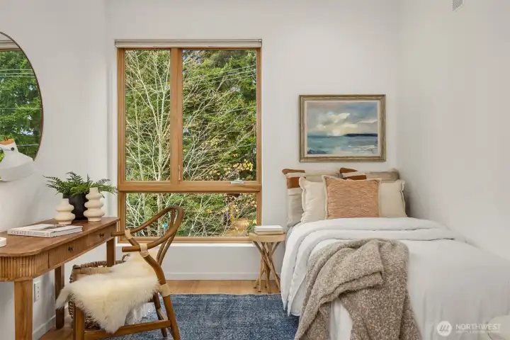 Large wooden west-facing windows welcome western light and seasonal colors.