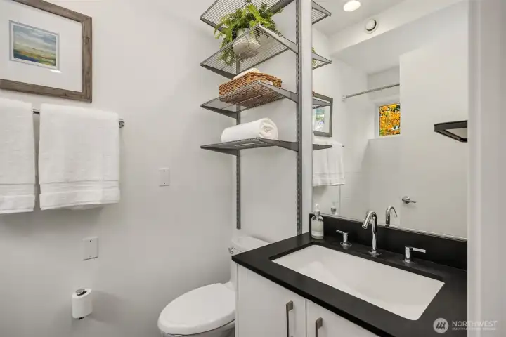 Just off the upper level landing, a shared bathroom with soaking tub/shower combo.