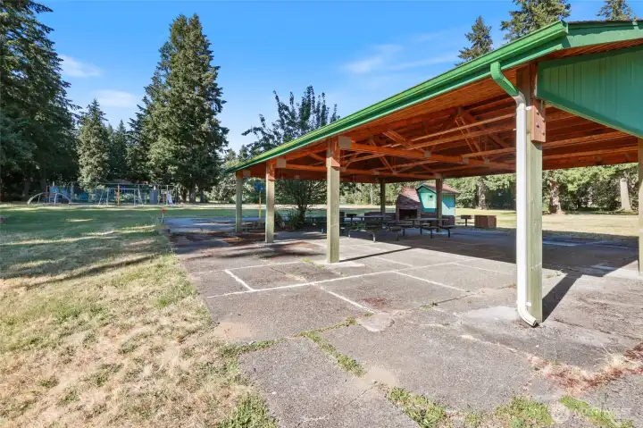 Features a covered community space, playground, tennis courts, and areas perfect for playing ball