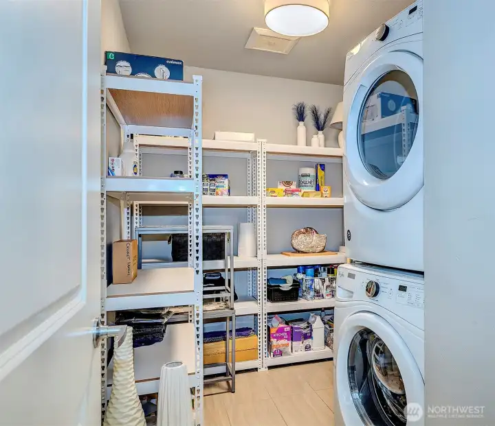 You will love this laundry room and all of the storage it provides.