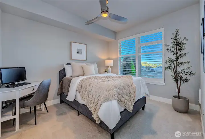 Large guest bedroom as beautiful views of Sound and Mt. Baker, plus it's large enough for a desk area. Spacious walk-in closet attached.