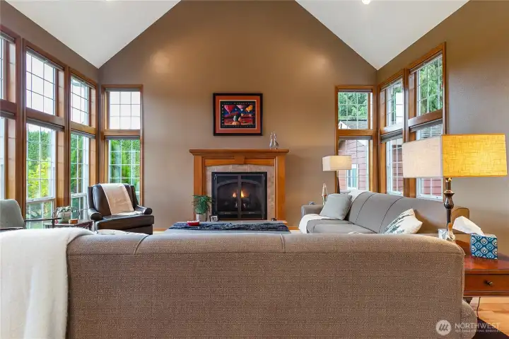 You can really see the natural light that floods in from these Transom windows illuminating the space. The cozy gas fireplace sits as the centerpiece, providing warmth and comfort throughout the seasons.