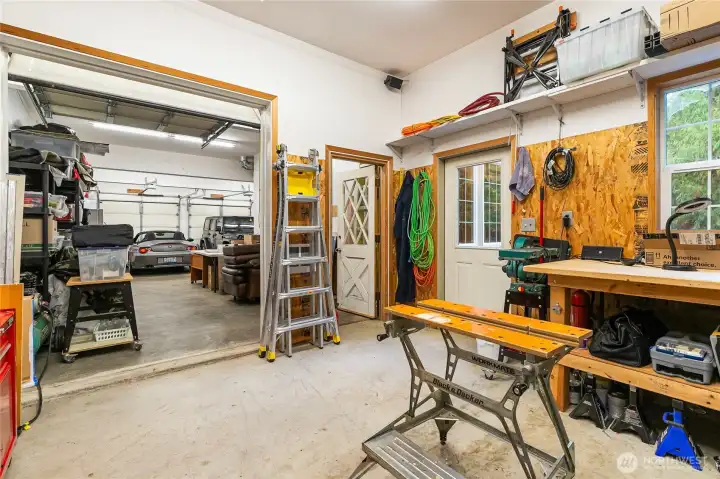View from the shop looking toward the garage. The shop can also be conveniently accessed from the outdoor patio.