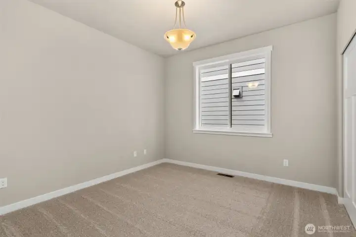 2nd bedroom/ Adjacent to full bathroom is the second bedroom featuring a large reach-in closet.