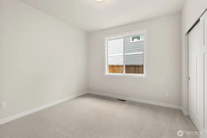 2nd bedroom/ Adjacent to full bathroom is the second bedroom featuring a large reach-in closet.