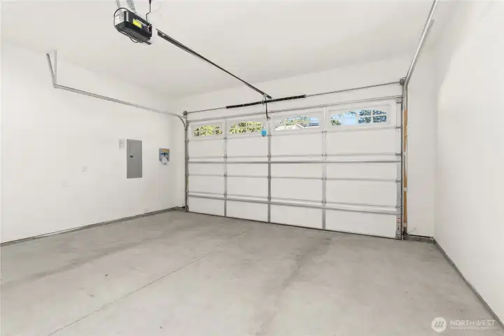 Two car garage with space for cars, tools, and more.