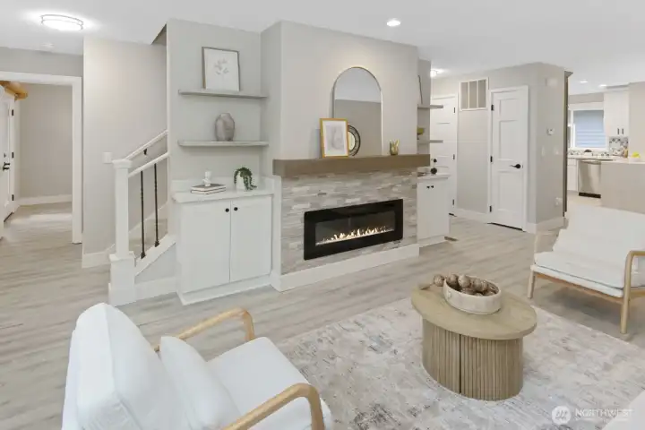 Main level living room with electric fireplace