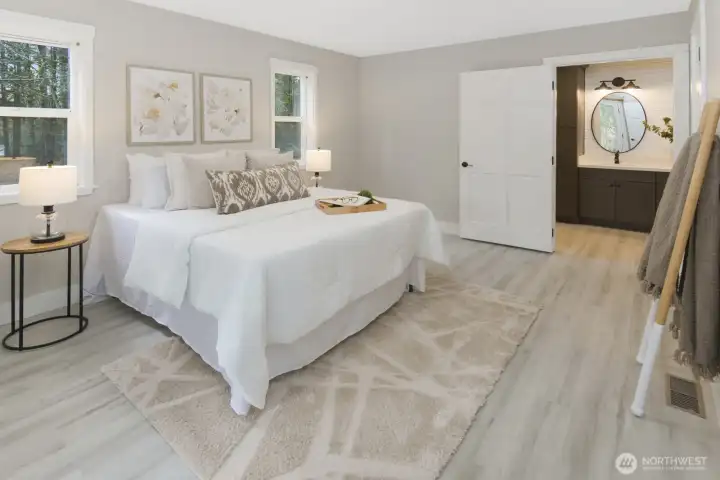 Primary bedroom with en-suite bath attached and french doors out to front patio