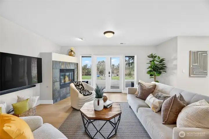 Lower level family room w/ gas fireplace, patio access