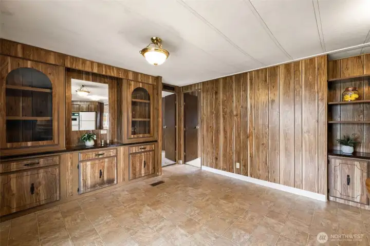 Dining room has built in cabinets and shelves too