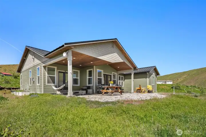 With over 3 and a half acres to roam, this home will "wow" you from the moment you step inside. Every window has a view. French doors lead to large, covered patio, perfect for year around outdoor living.