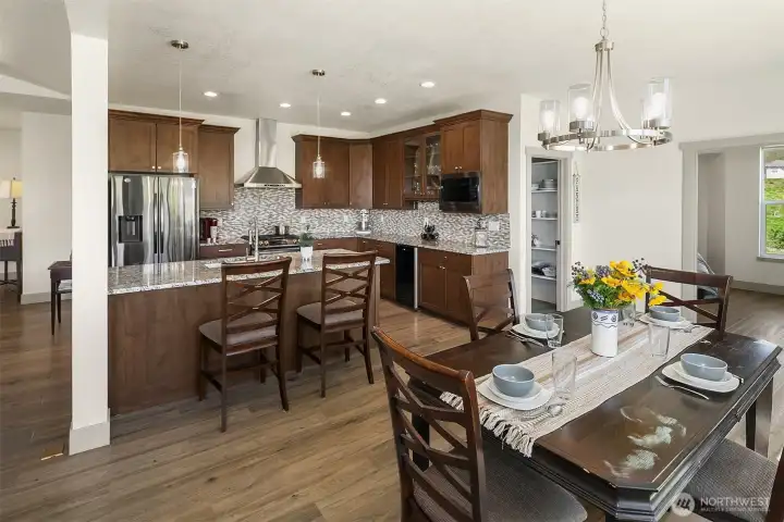Beautifully tiled backsplash, huge walk in pantry, wine fridge and stainless appliances