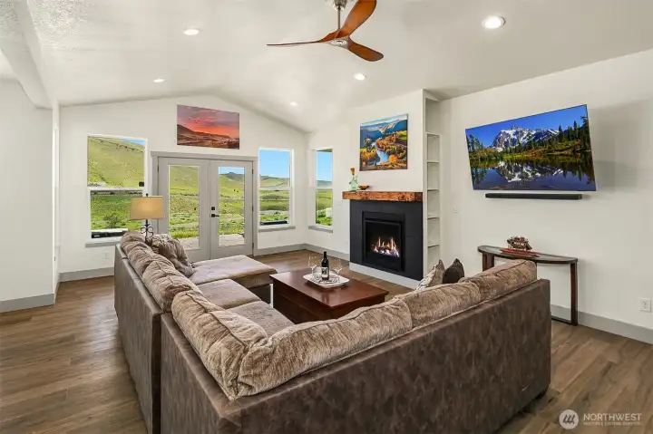 Check out those views! French doors lead to back yard and covered patio area for afternoon BBQ's and total relaxation after a long day