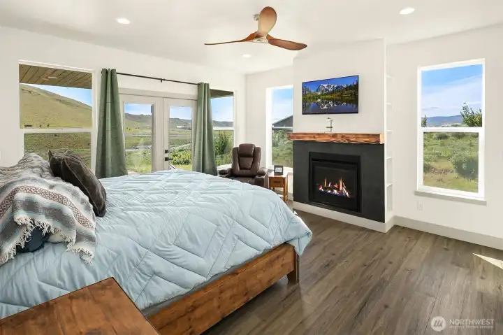 You will LOVE this primary suite...cozy gas fireplace, windows with amazing views, French doors leading to covered patio area and en-suite bath with huge walk in closet