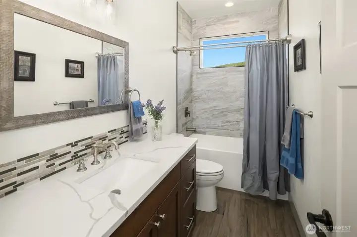 Another full bath on main floor of home between bedroom #2 and bedroom #3