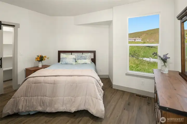 Bedroom #3 has large walk in closet with sliding barn door and again, views out every window! Light, bright and airy