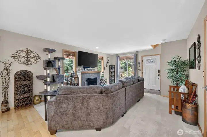 Enter into living room.  Tons of windows to bring in natural light and enjoy the Northwest views.