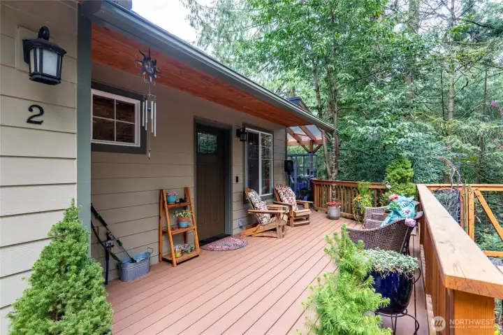Extensive composite decking around front and side of home.