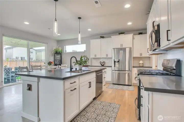 The stainless steel appliances stay with the home. Including the wine refrigerator.