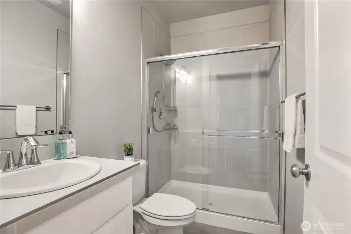 The main level 3/4 bathroom is located next to the main floor bedroom.