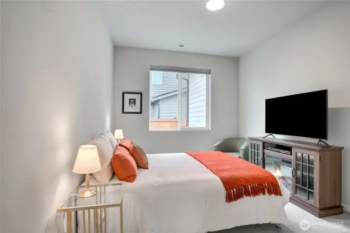 The spacious main level bedroom is great for guests or a home office.