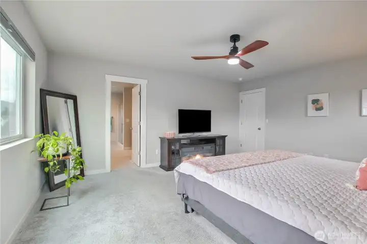 The smart layout and window placement allows for a television in the primary bedroom.