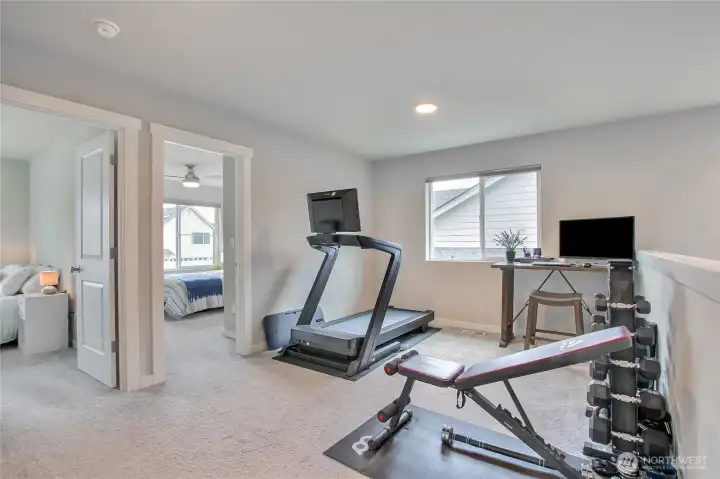 The upper-level loft. Think home office, in-home theater, playroom, workout space... the possibilities are endless.