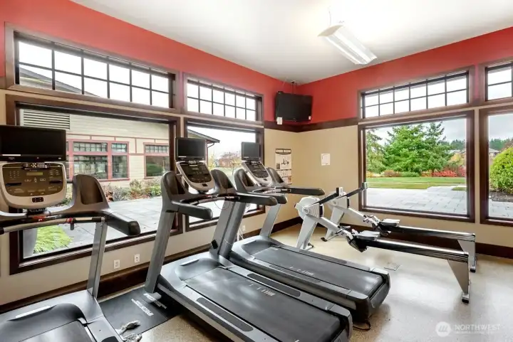 Exercise room with weights and cardio equipment