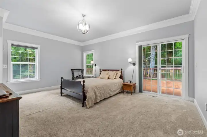 Primary Bedroom Retreat with fireplace, sliding door out to the deck, and 5-piece en-suite.