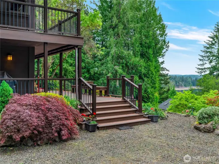 Step up onto the front deck and porch and take in Hood Canal view