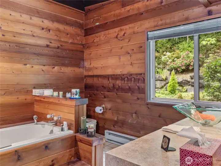 Soaking tub in primary bedroo