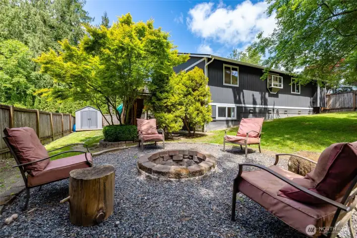 Beautiful large side yard with fire pit.