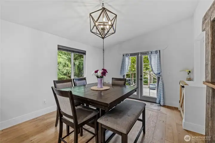 Large space for dining and a door to the back deck