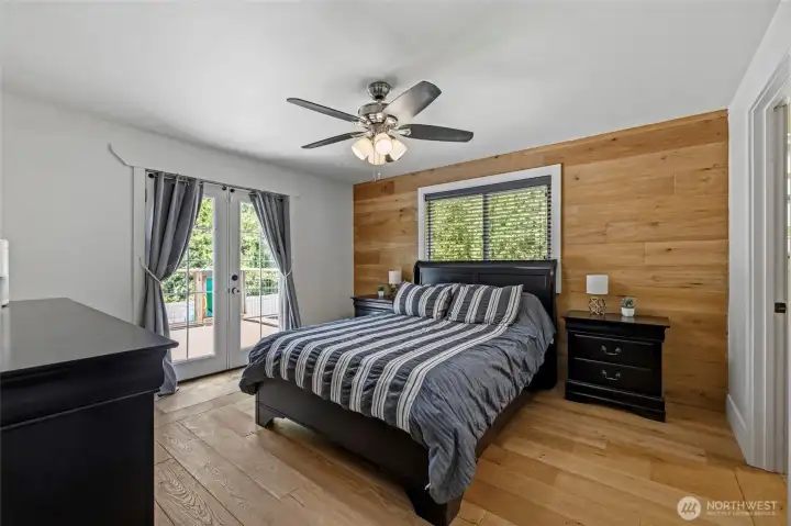 Main Level-Primary bedroom with slider to the back deck