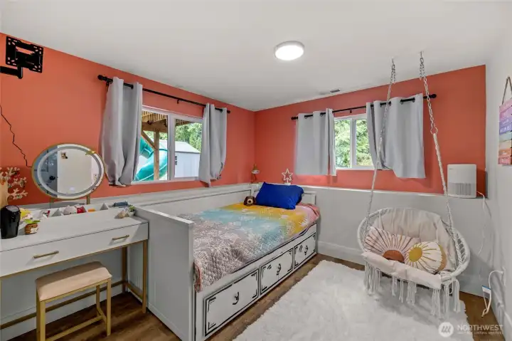 Downstairs bedroom with oak floors