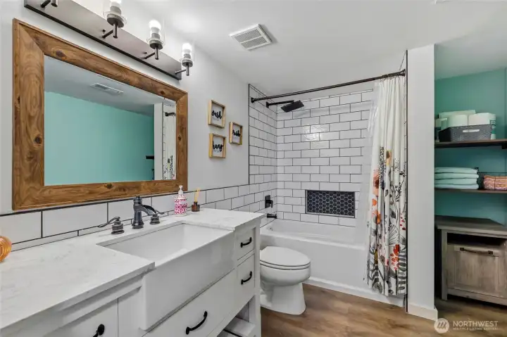 New tastefully designed full bathroom downstairs.