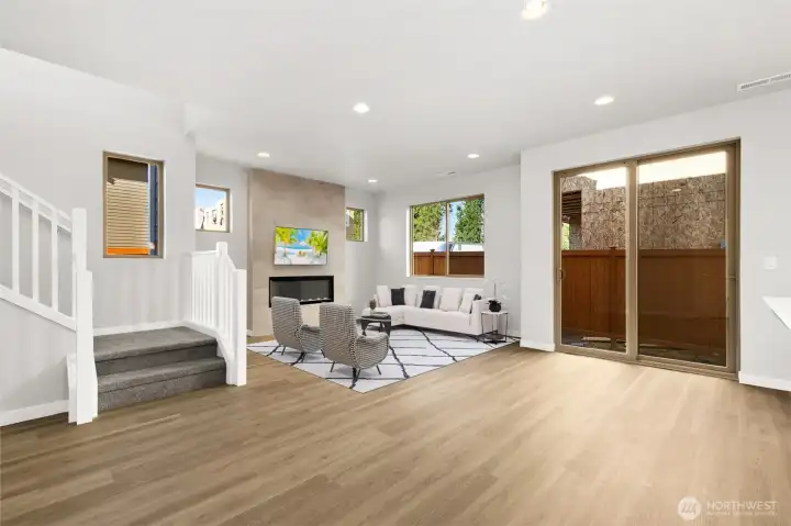Open Living and Dining room that leads to the patio through large sliders for indoor/outdoor living. Virtually staged. Open Living and Dining room that leads to the patio through large sliders for indoor/outdoor living. Virtually staged.