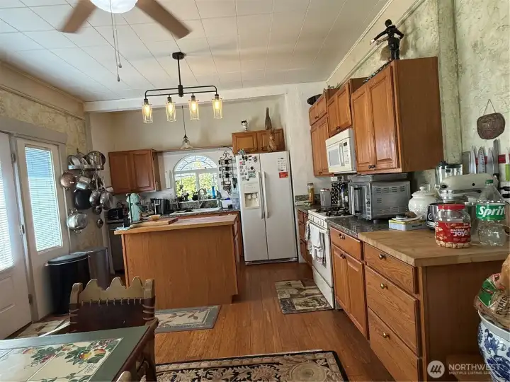 Kitchen with island, loads of cabinets and great working space Kitchen with island, loads of cabinets and great working space